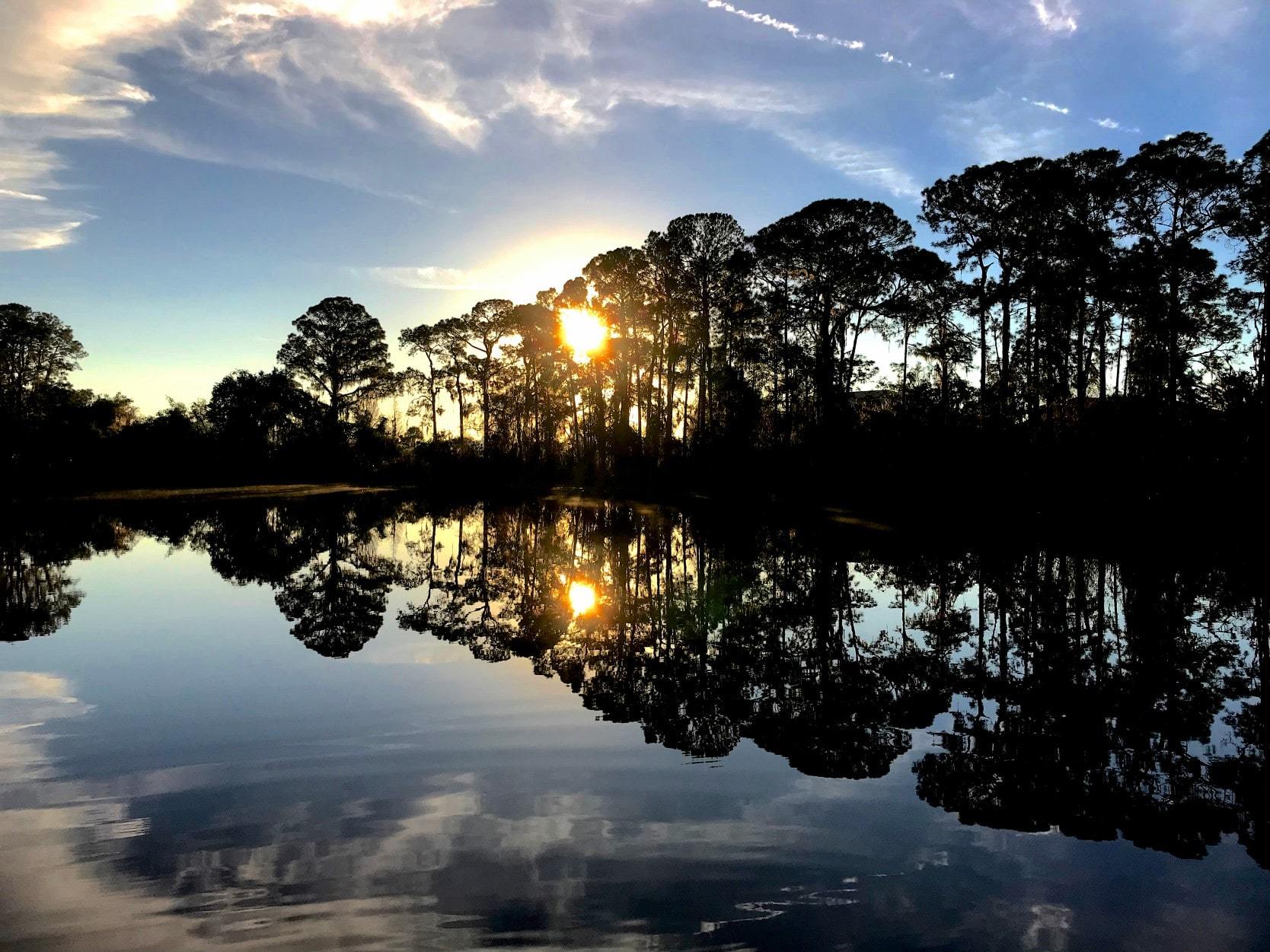 Sun setting over a lake in Davenport, Florida